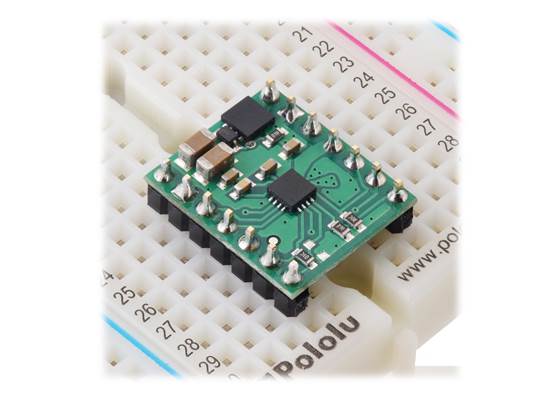 DRV8876 (QFN) Single Brushed DC Motor Driver Carrier plugged into a breadboard.