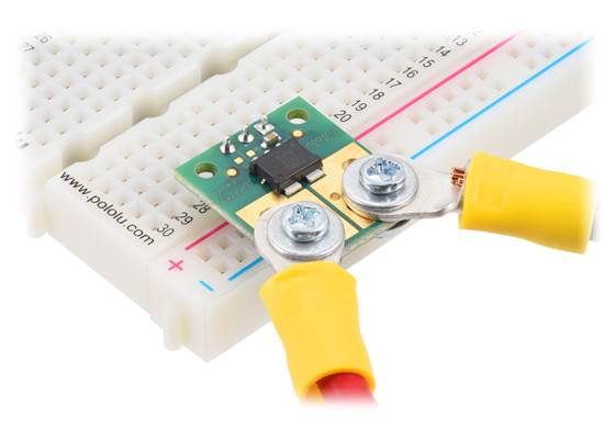 ACS72981 Current Sensor Compact Carrier with wires connected via solderless ring terminals and header pins soldered for use with a breadboard.