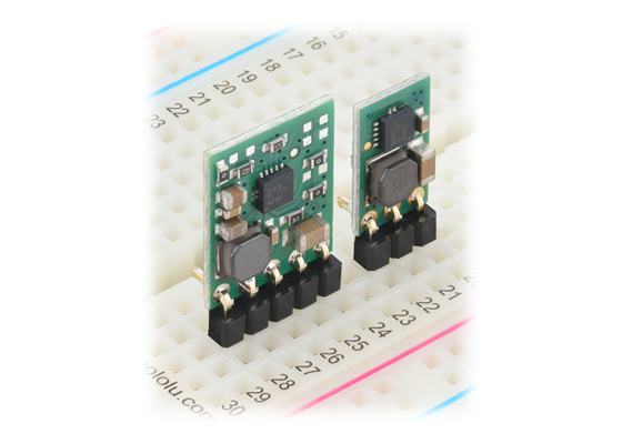 D45V1ExFx step-down voltage regulators, soldered with right-angle header pins (not included), on a breadboard.