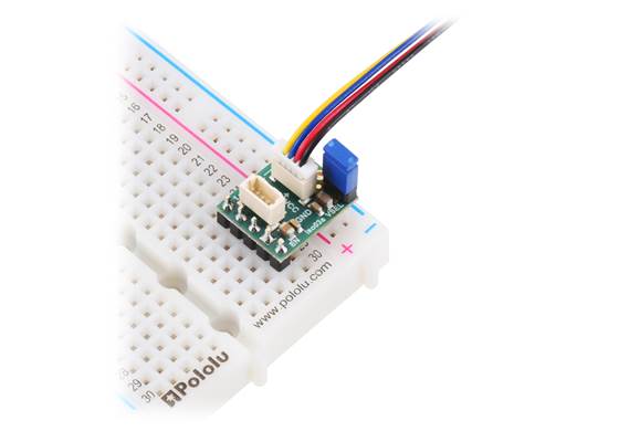 Pololu I²C Isolator with Isolated Power and Connectors, shown with 3v3 output jumper, breadboard connection on power input side, cable connection on power output side (cable, headers, and shorting block not included).