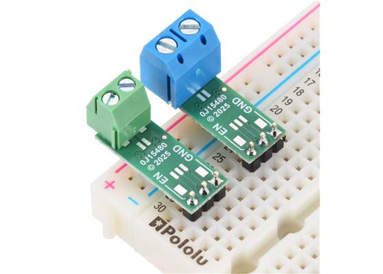 Pololu Isolated Solid State Relay/Switch (SPST) boards soldered with 3.5mm-pitch (left) and 5mm-pitch (right) terminal blocks for load connections and 0.1″ male headers for EN, VIN, and GND control connections.  (Headers and terminal blocks not 