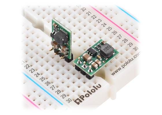 D24V7Fx step-down voltage regulators, soldered with straight and right-angle headers (not included), on a breadboard.