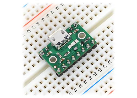 FPF1320 power multiplexer carrier with USB Micro-B connector in a breadboard.