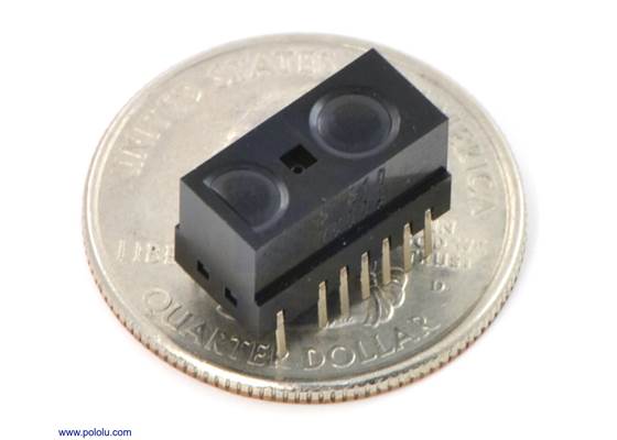Sharp GP2Y0D805Z0F, GP2Y0D810Z0F, or GP2Y0D815Z0F digital distance sensor on a US quarter for size reference.
