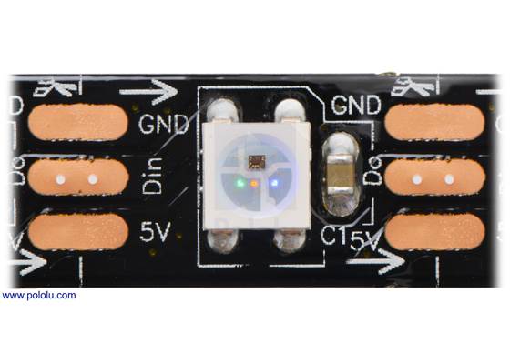 Close up of one segment of a SK6812-based LED strip with the red, green, and blue LEDs on at their dimmest setting.