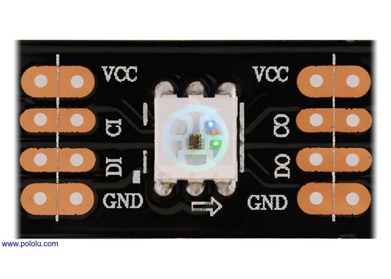 Close up of one segment of an SK9822-based LED strip, with the red, green, and blue LEDs on at a low brightness.