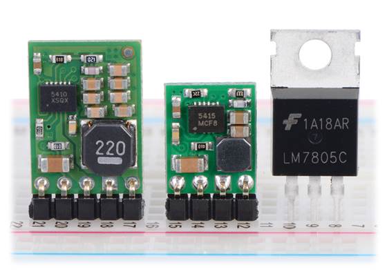 Pololu step-down voltage regulators D24V10Fx and D24V5Fx next to a 7805 voltage regulator in TO-220 package.