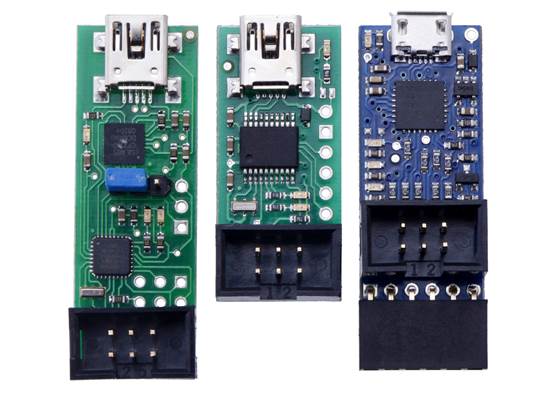 From left to right: the original Orangutan USB Programmer, the Pololu USB AVR Programmer, and the Pololu USB AVR Programmer v2 (which looks almost the same as v2.1).