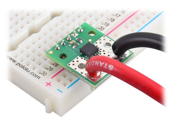 ACS37220 Current Sensor Compact Carrier with wires soldered directly to the board and header pins soldered for use with a breadboard.