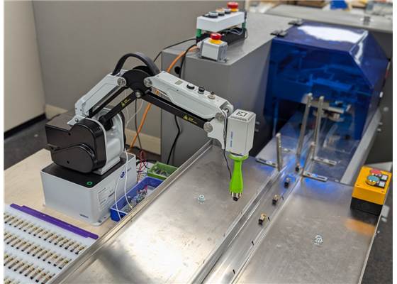 Dobot MG400 with 3D-printed electromagnet end effector packaging Micro Metal Gearmotors. (1)